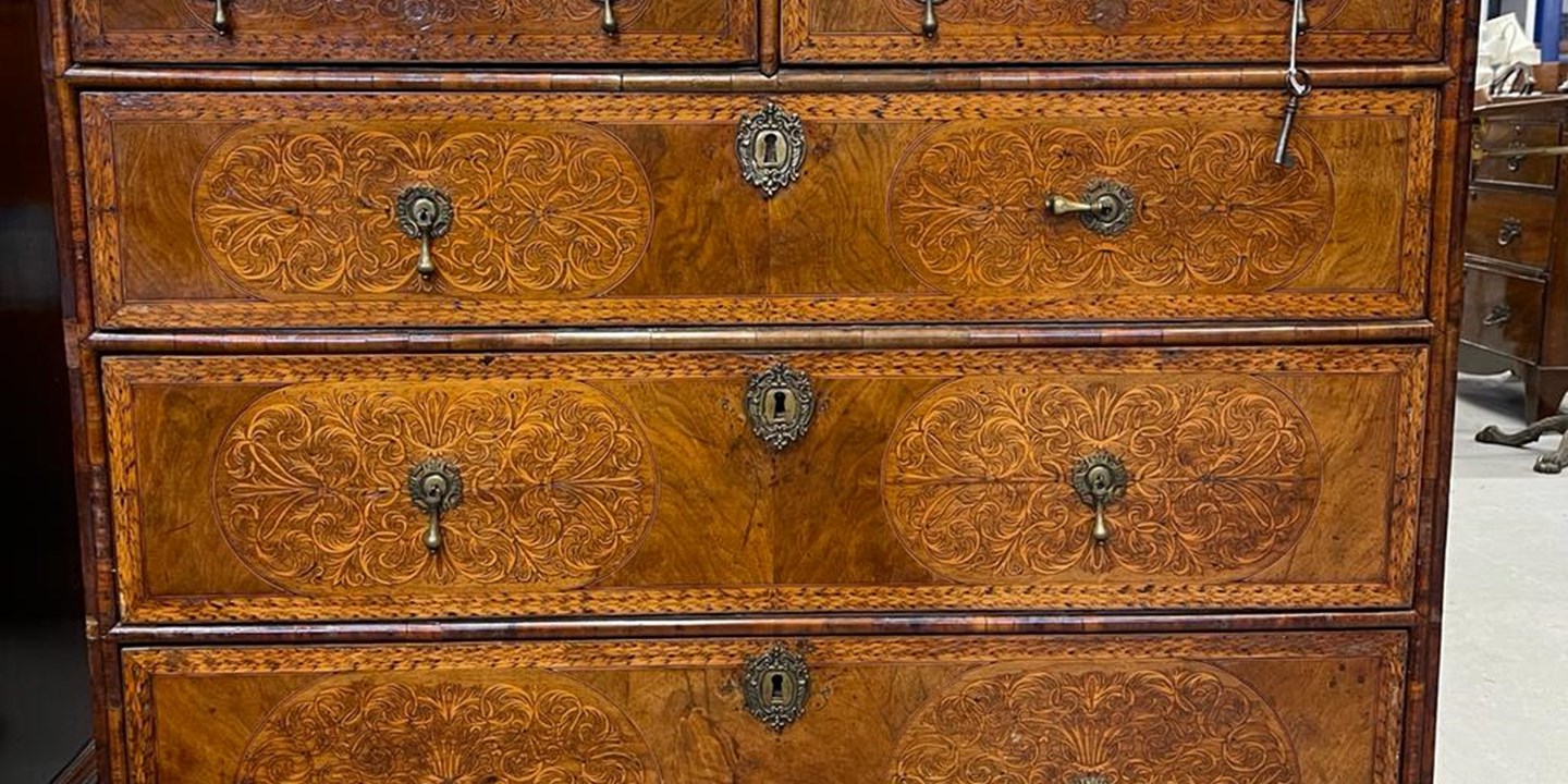 18th cent. Walnut chest of drawers, with seaweed marquetry inlay Sold for £8000